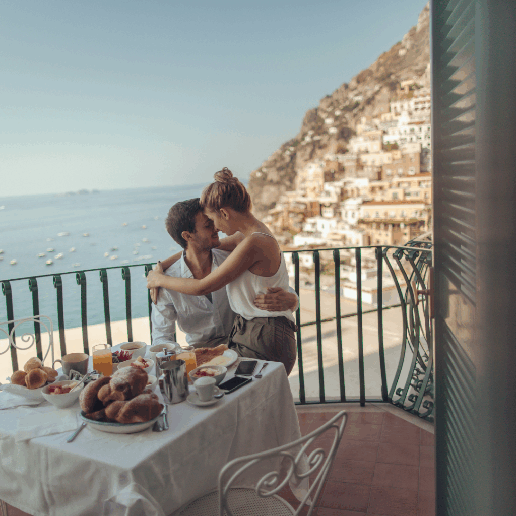 Couple having a romantic breakfast in Amalfi Coast