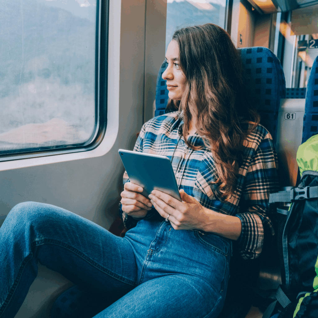 Woman on a train reading a book